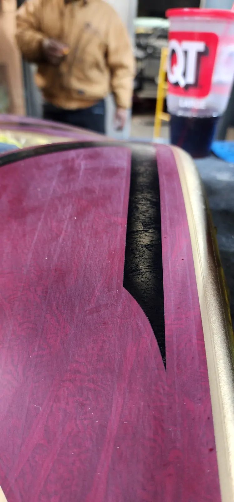 Smyrna custom paint — close-up of a magenta panel with black graphic and gold pinstripe