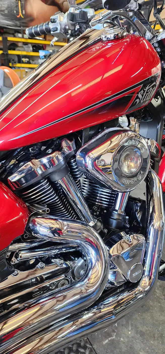 matte vs gloss paint Douglasville — glossy red Yamaha Star tank with pinstriping over a chrome V-twin