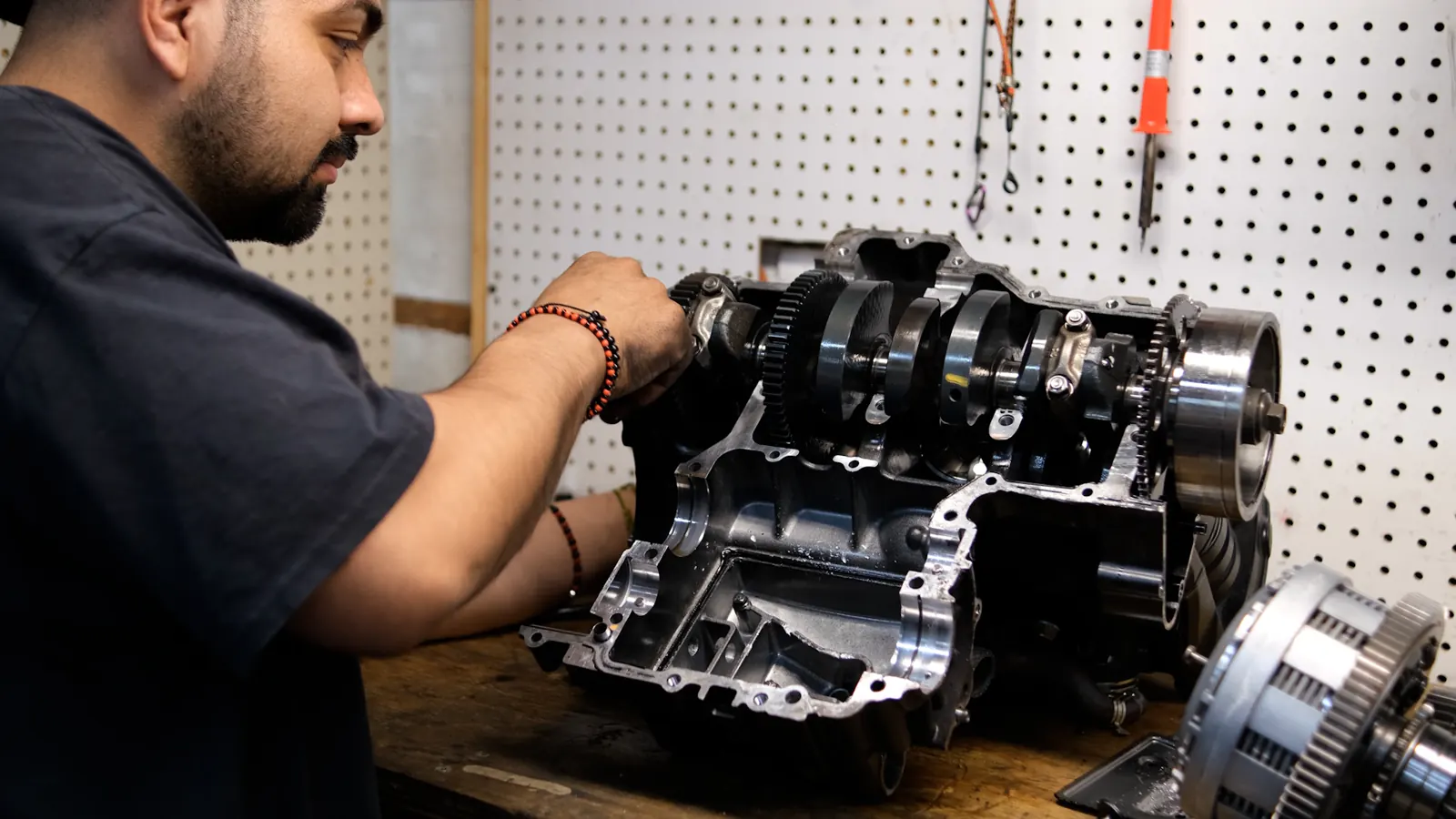 Motorcycle service for Bartow riders — engine bottom end apart with crankshaft and clutch basket on the bench