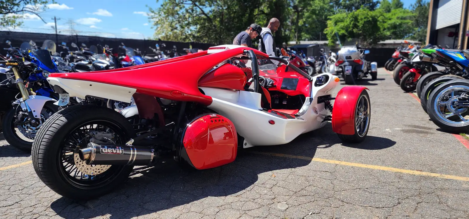 Motorcycle service Woodstock — red and white Campagna T-Rex three-wheeler with a Devil exhaust parked in our lot