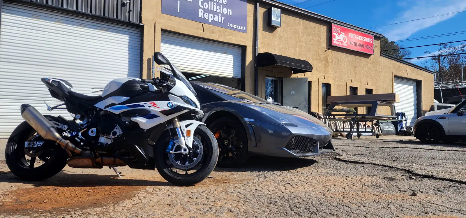 motorcycle transport Canton — white and blue BMW S1000RR parked by the Diaz shop building