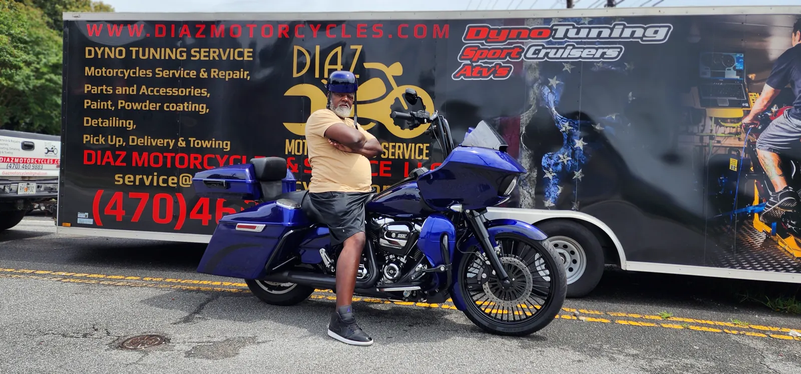 enclosed transport Acworth — customer with a purple-blue Harley Road Glide bagger by the Diaz trailer